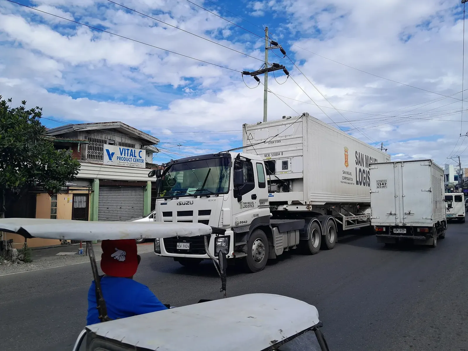 Box trucks lined up at a depot ready for the day's delivery routes
