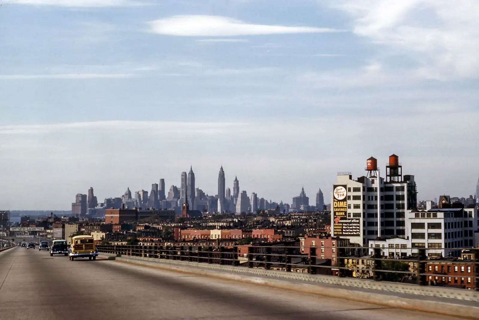 A distribution corridor highway running toward a distant city skyline